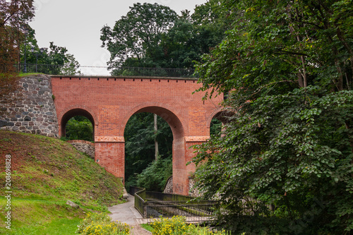 an old brick bridge with arches
