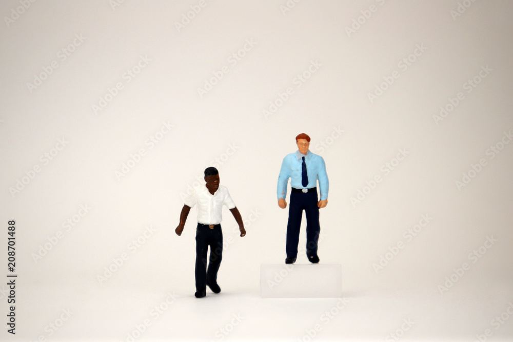 custom made wallpaper toronto digitalThe concept of invisible barriers by race in the labor market. Two miniature businessmen.