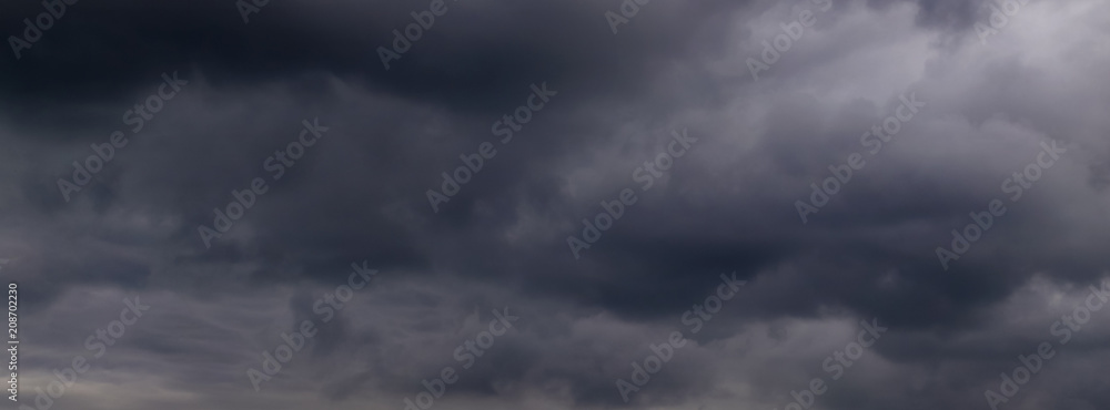 black clouds in the blue evening sky