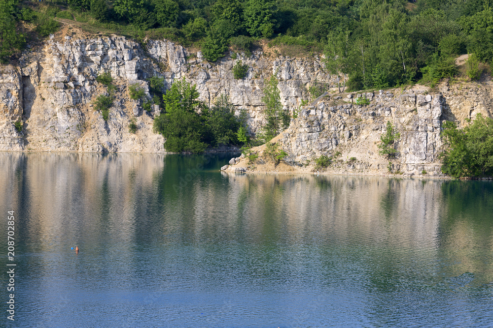 Lagoon Zakrzowek in an old limestone quarry, emerald water, Krakow, Poland.