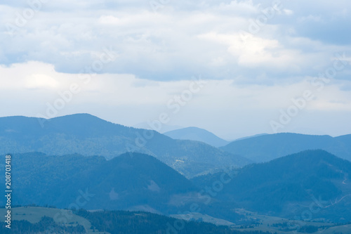 Magnificent landscape with blue mountains © byrdyak