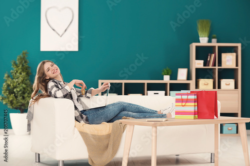 Young woman shopping online...