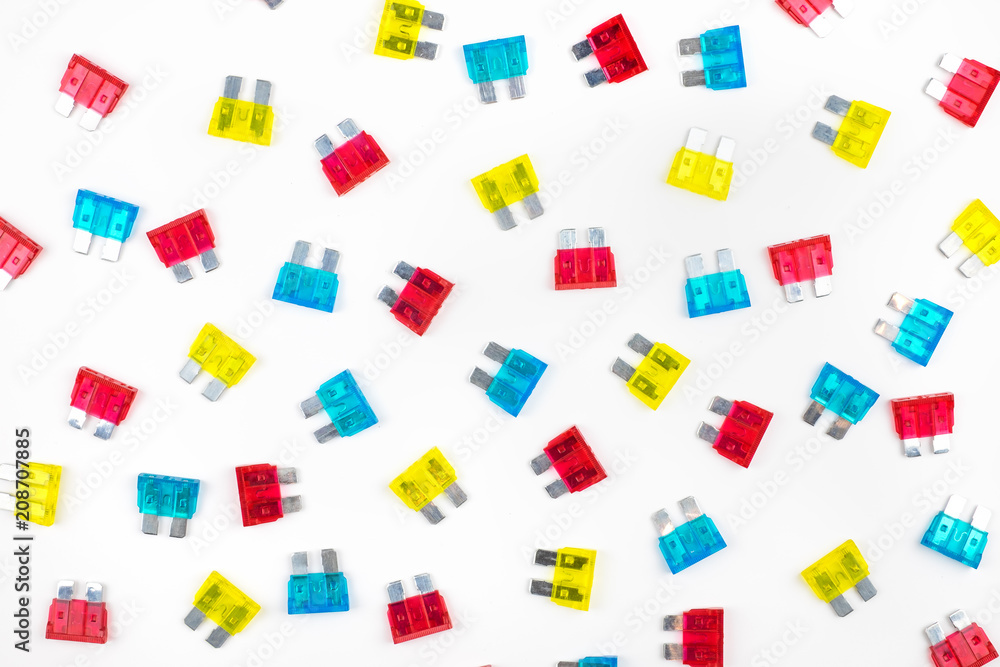 Compose of many colorful electrical automotive car fuse red, blue,yellow colors isolated on white background. Compose of many colorful electrical automotive car fuse red, blue,yellow colors isolated on white background.