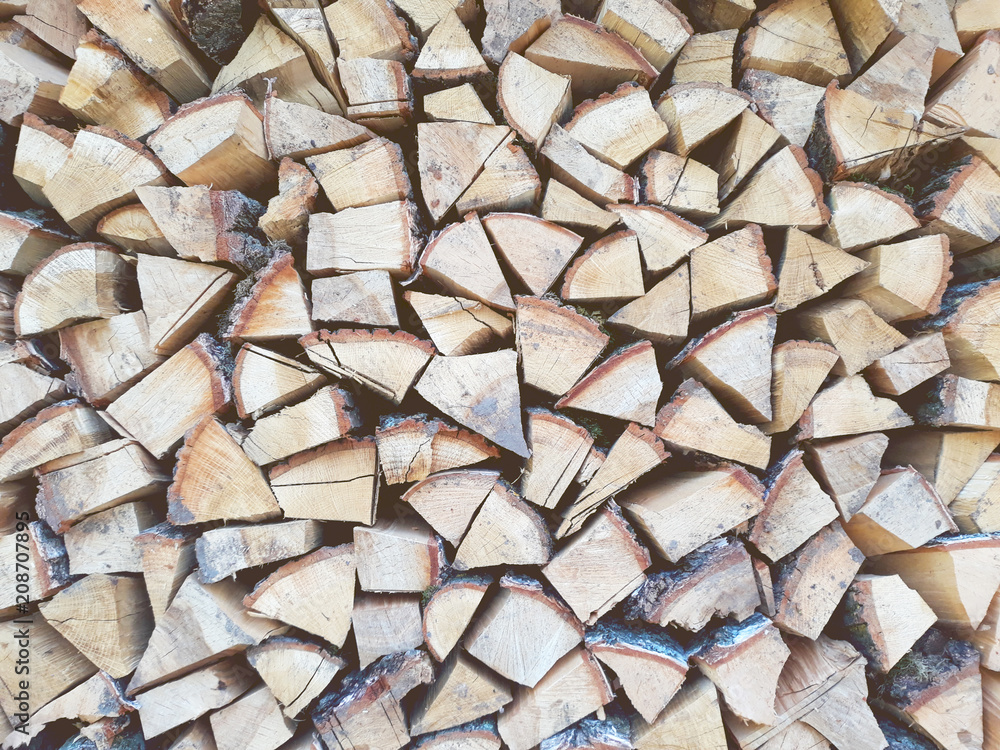 Firewood background, wall firewood, background of dry chopped firewood logs in a pile