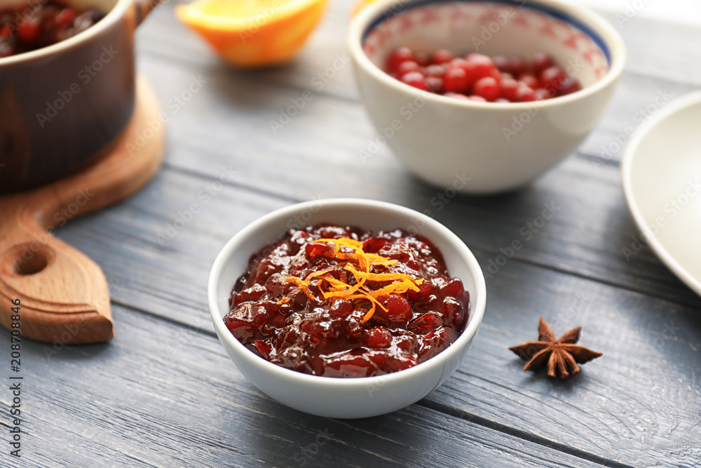 Bowl with tasty cranberry sauce on table Bowl with tasty cranberry sauce on table