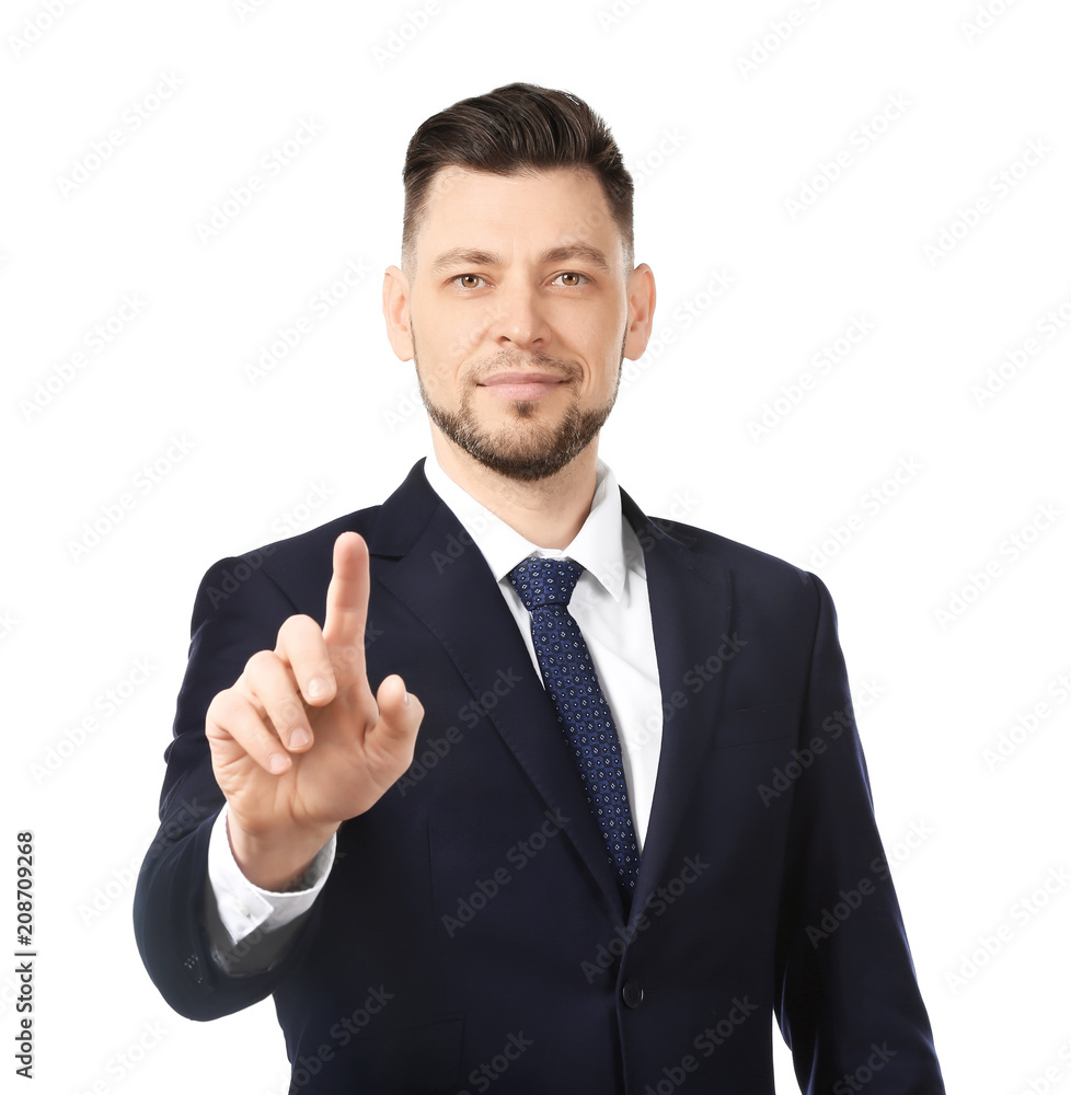 Young businessman using virtual screen on white background Young businessman using virtual screen on white background