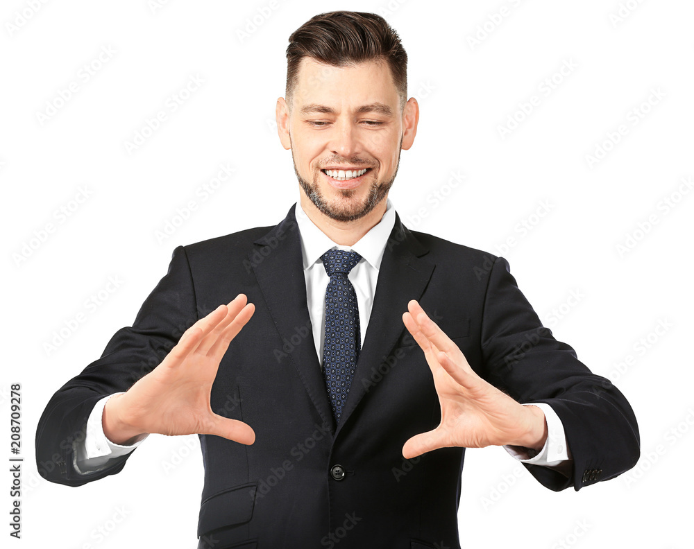 Young businessman holding something on white background Young businessman holding something on white background