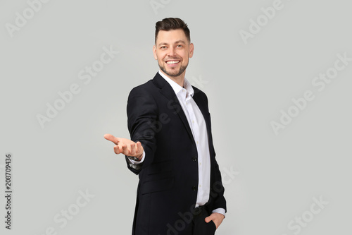 Young businessman holding s...