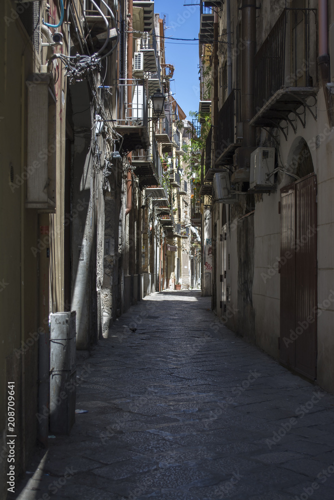 Narrow street in city of Palermo, Sicily, Italy