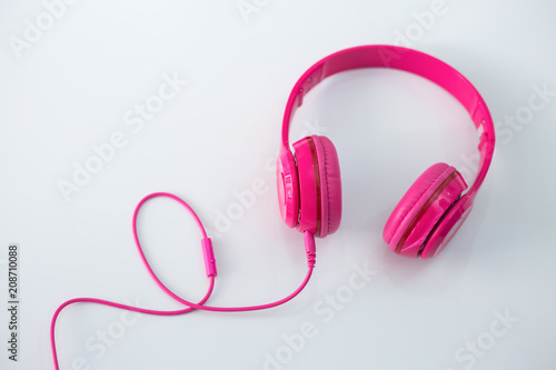 Pink headphones on a white background.