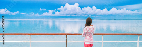 Cruise ship travel tourist woman on boat deck looking a peaceful summer night sky after rain. Serene still ocean water landscape. Tourism vacation holidays sailing away.