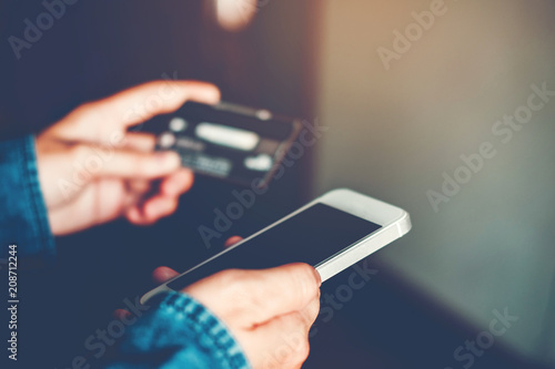 Online banking businessman using smartphone with credit card Fintech and Blockchain concept photo