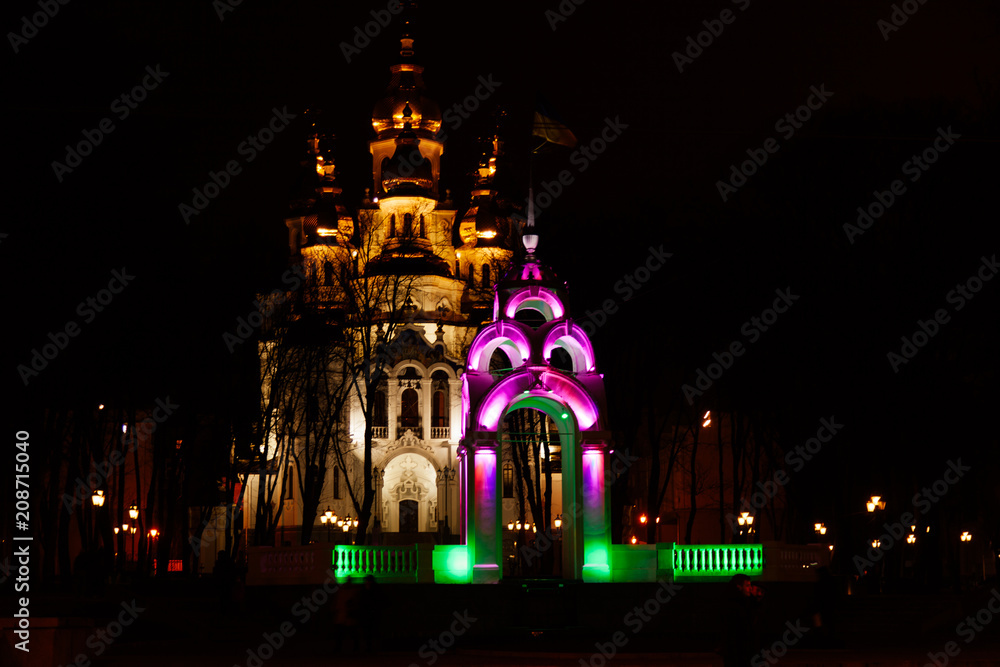 Obraz premium arc mirror jet Kharkov in the evening colorful backlight