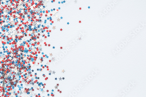 4th of July American Independence Day decorations on pastel blue background. Flat lay, top view, copy space