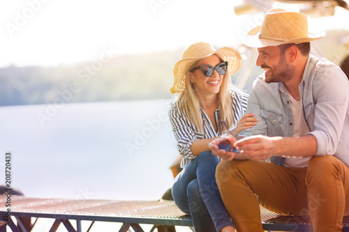 Young couple resting on dock