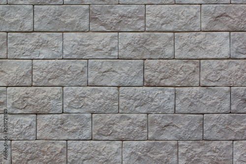 Brick wall with big gray bricks. Used as a background.