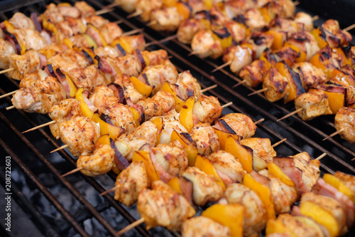 Grilled vegetable and meat skewers on a grill pan. Shish kebab from chicken  pepper and bacon