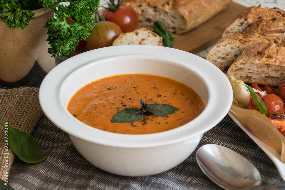 Roasted pepper soup and roasted tomatoes with fresh basil and home-made onion baguette Roasted pepper soup and roasted tomatoes with fresh basil and home-made onion baguette