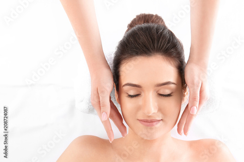 Young woman receiving face ...