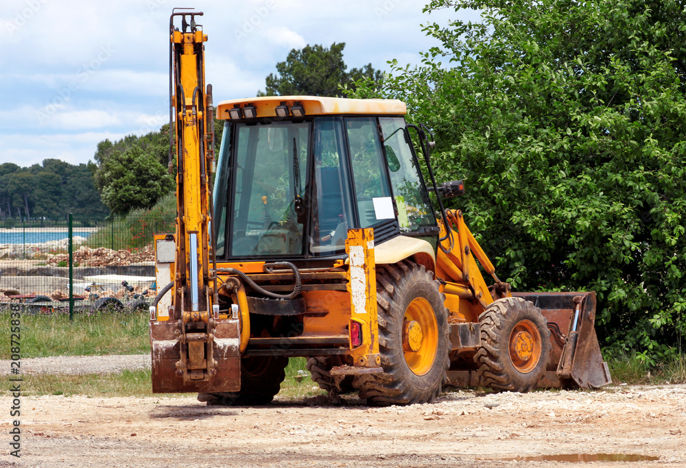Yellow excavator, bulldozer machine and worker tractor. Road works. Road machinery at construction site. Road company and building machines for construction. Industry, renovation and infrastructure. Yellow excavator, bulldozer machine and worker tractor. Road works. Road machinery at construction site. Road company and building machines for construction. Industry, renovation and infrastructure.