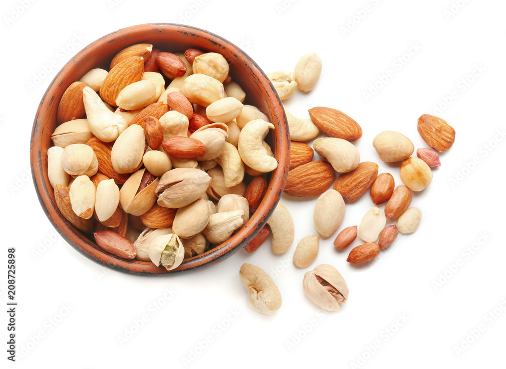 Different nuts in bowl on white background Different nuts in bowl on white background