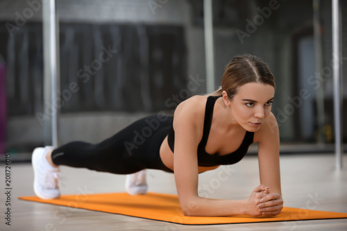 Young woman training in modern gym