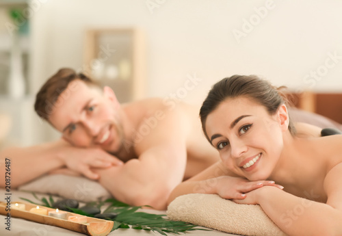 Young couple relaxing in spa salon