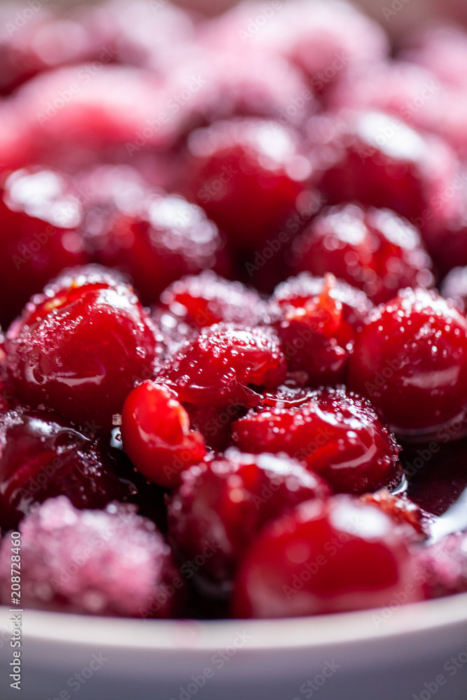 Cherry jam. Close up of simmering homemade cherry jam. Cherry and sugar crystal. Stewed cornel (dogwood or cornelian cherry) background or texture. Rfood background. Macro close-up. food photography Cherry jam. Close up of simmering homemade cherry jam. Cherry and sugar crystal. Stewed cornel (dogwood or cornelian cherry) background or texture. Rfood background. Macro close-up. food photography