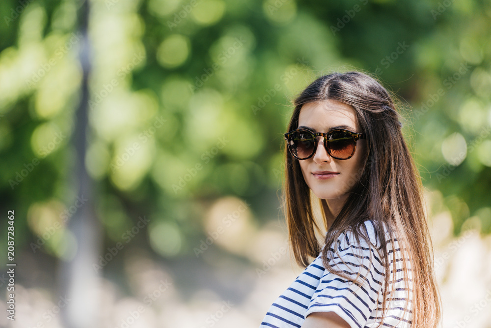 portrait of of beautiful young woman in sunglasses on street portrait of of beautiful young woman in sunglasses on street