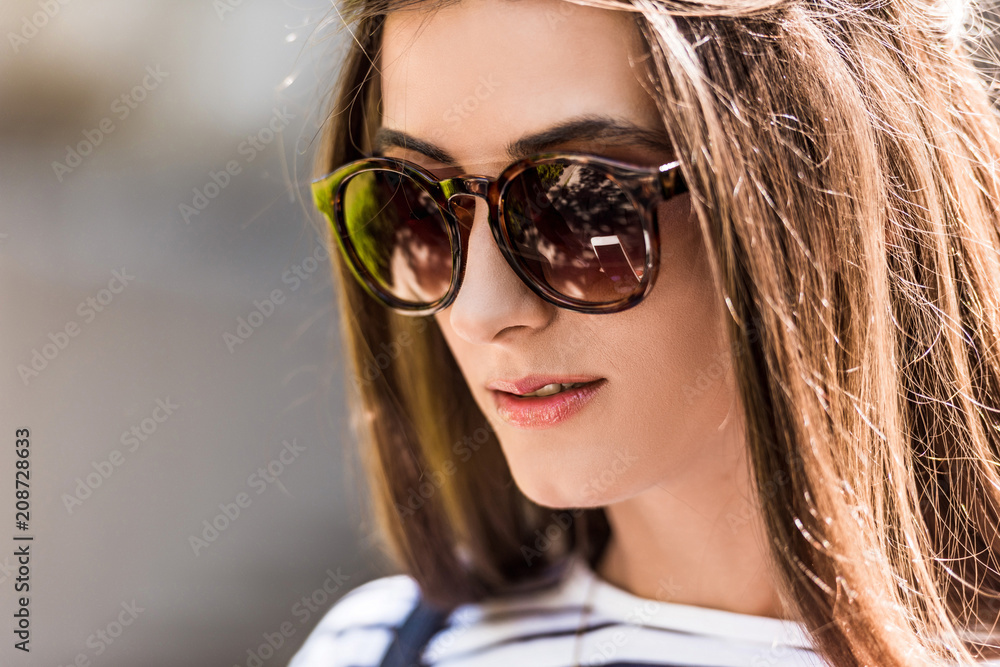 portrait of of beautiful young woman in sunglasses on street portrait of of beautiful young woman in sunglasses on street