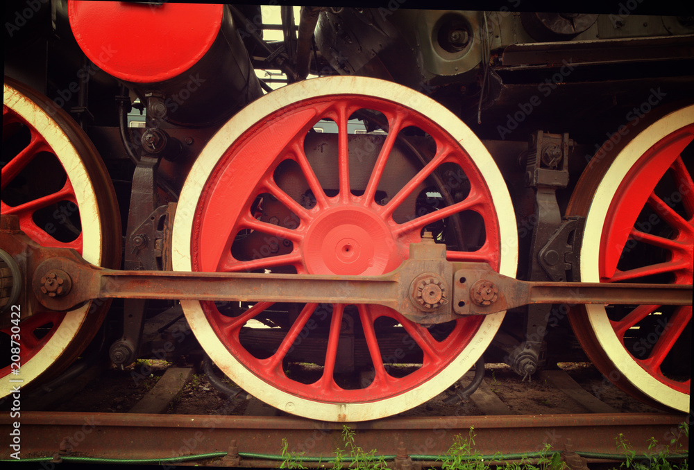Steam train red wheels close up