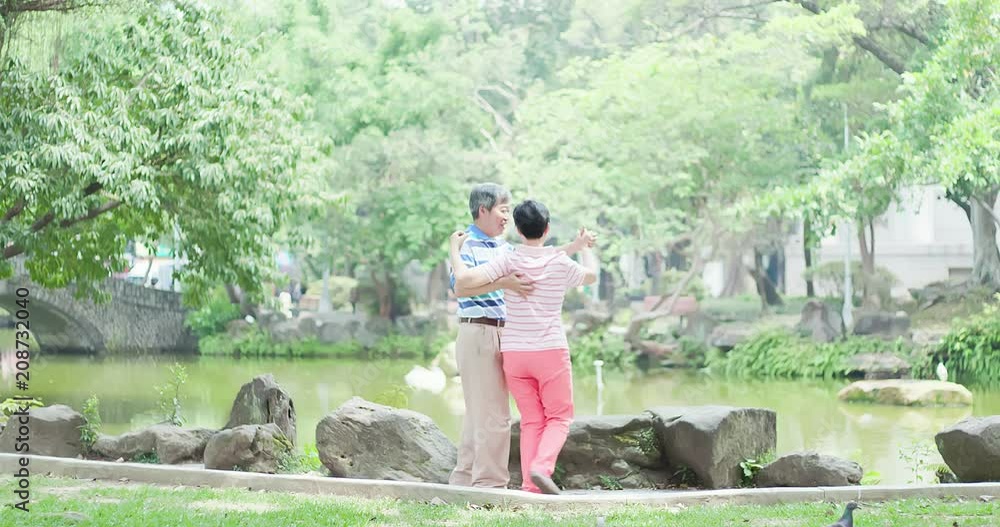 old couple dance in park old couple dance in park