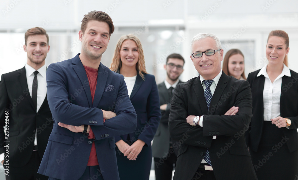 business partners standing in front of the business team. business partners standing in front of the business team.