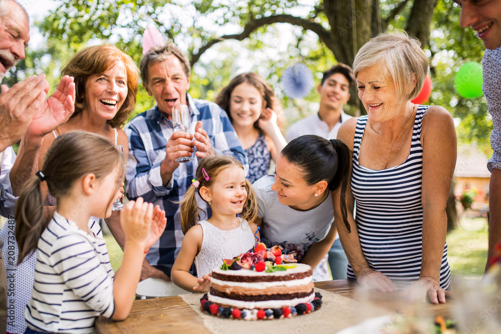 Family celebration or a garden party outside in the backyard. Family celebration or a garden party outside in the backyard.
