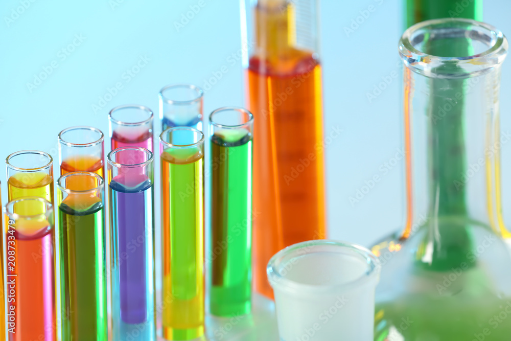 Test tubes with colorful liquids in rack, closeup Test tubes with colorful liquids in rack, closeup