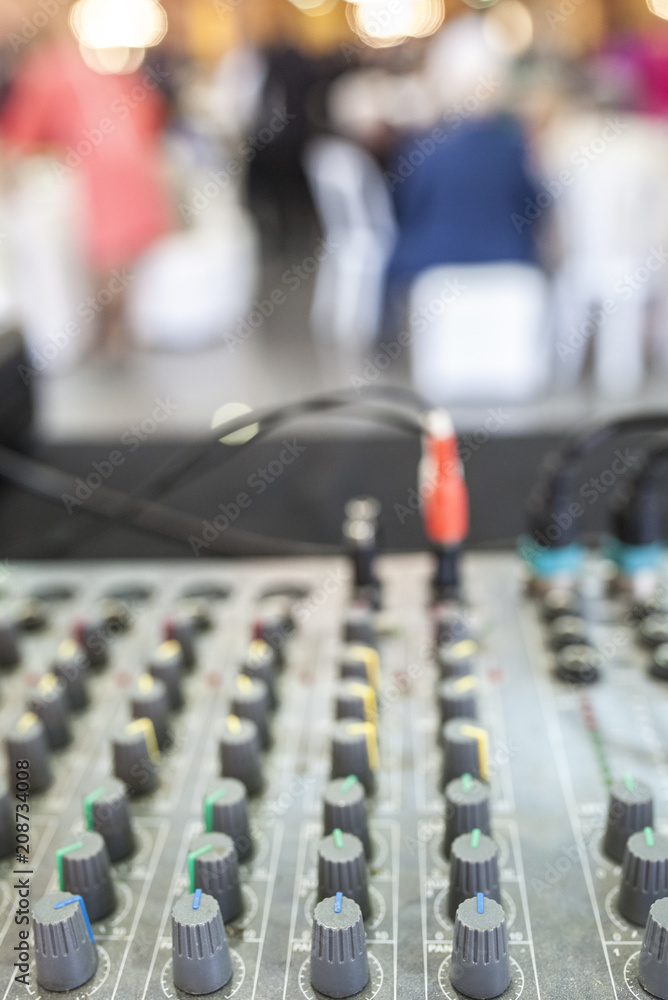 DJ soundboard at work white the guests are dinning DJ soundboard at work white the guests are dinning