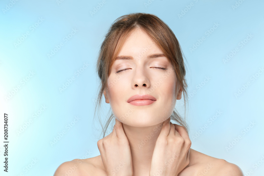 Beautiful young woman with silky skin on color background Beautiful young woman with silky skin on color background