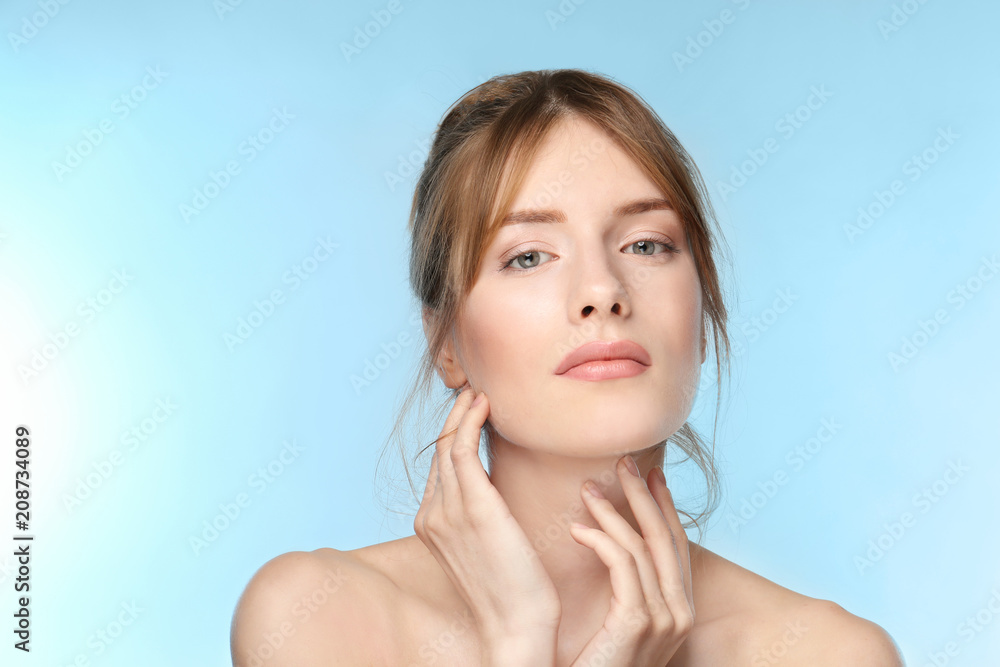 Beautiful young woman with silky skin on color background Beautiful young woman with silky skin on color background