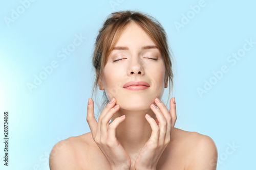 Φωτογραφία Beautiful young woman with silky skin on color background