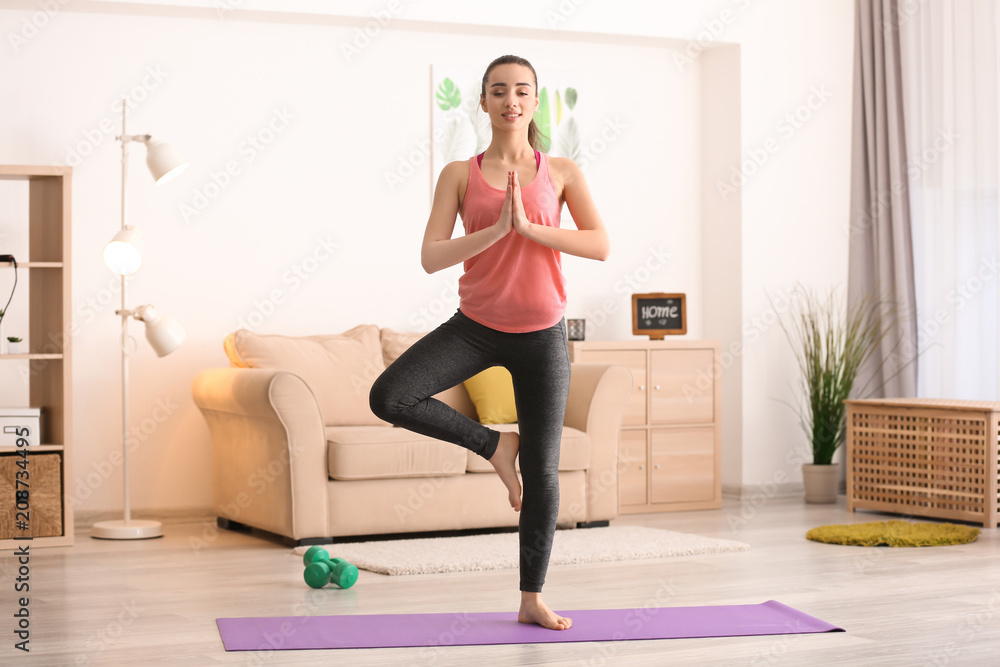 Beautiful young woman doing exercises in morning Beautiful young woman doing exercises in morning