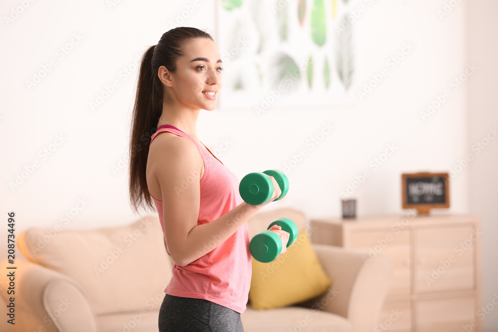 Beautiful young woman doing exercises in morning Beautiful young woman doing exercises in morning