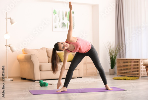 Beautiful young woman doing...