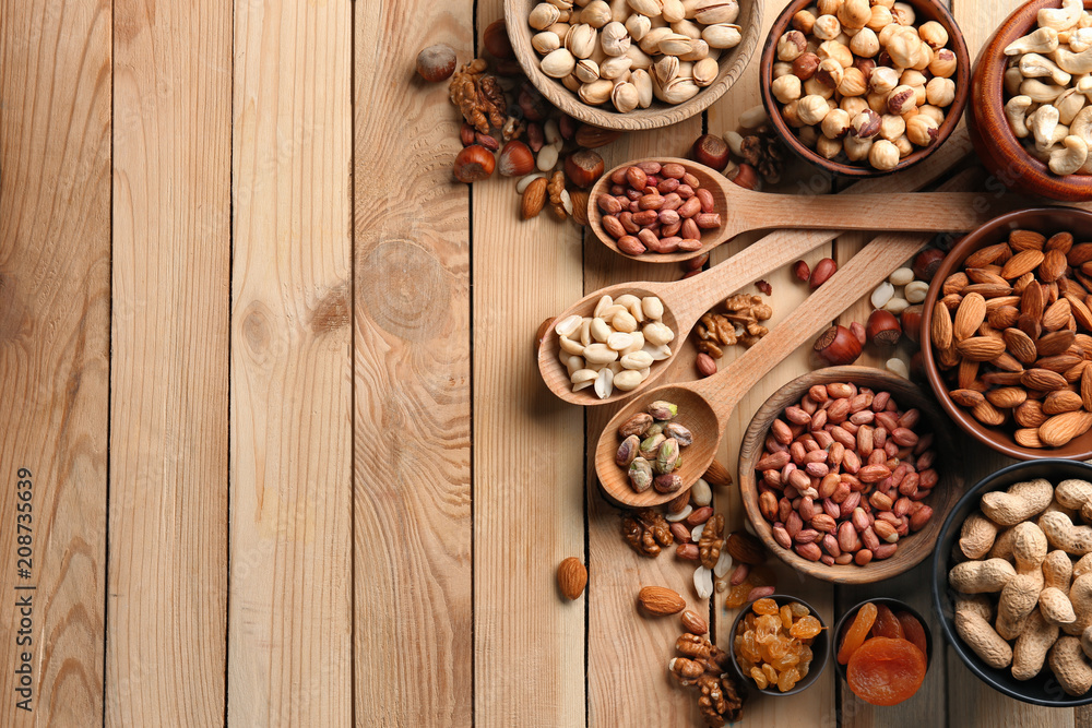 Composition with different nuts on wooden background Composition with different nuts on wooden background