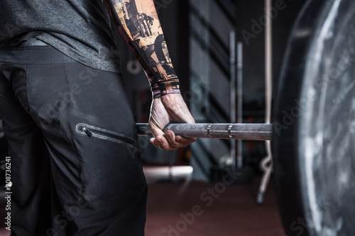 Hand on the barbell