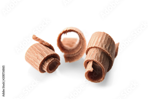 Delicious chocolate curls on white background