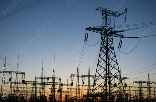 high-voltage power lines at sunset. electricity distribution station. high voltage electric transmission station
