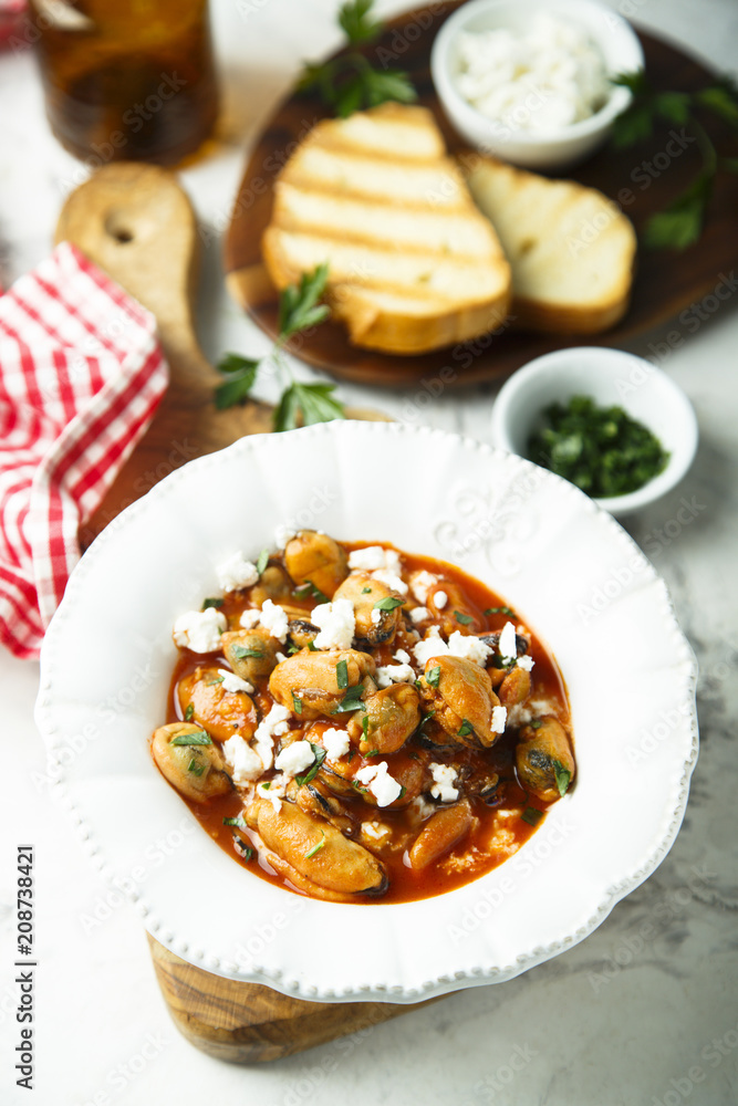 Seafood stew with mussels, tomatoes and Feta cheese Seafood stew with mussels, tomatoes and Feta cheese