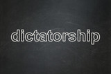 Political concept: text Dictatorship on Black chalkboard background