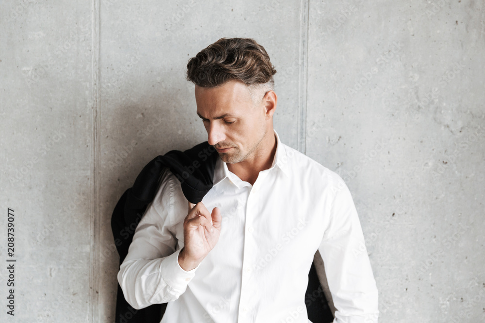 Attractive man with jacket over his shoulder Attractive man with jacket over his shoulder