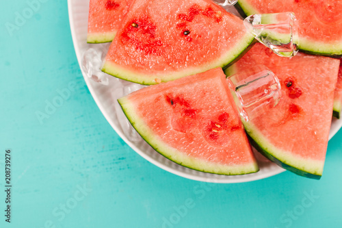 Fresh watermelon slices on ice cubes